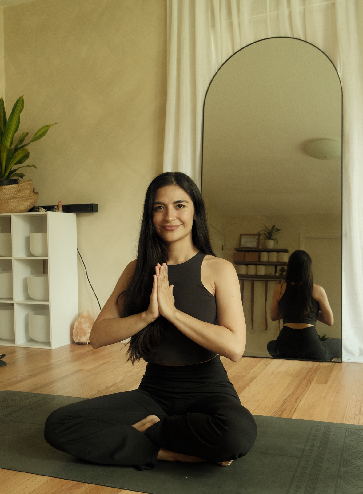 Jennifer Tostado practicing yoga at Harmony Oak Yoga